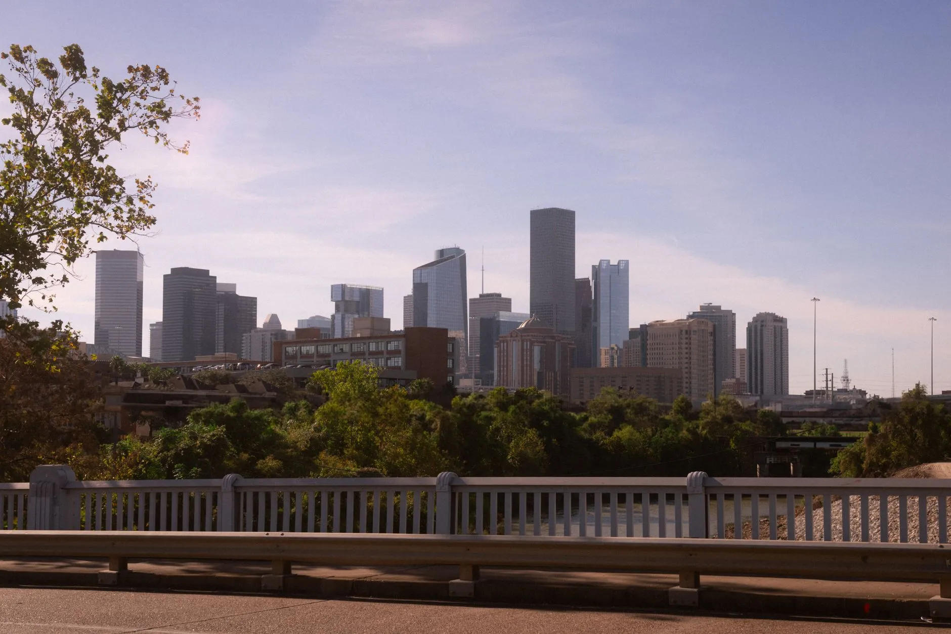 The downtown Houston skyline seen from across a bridge on a clear day