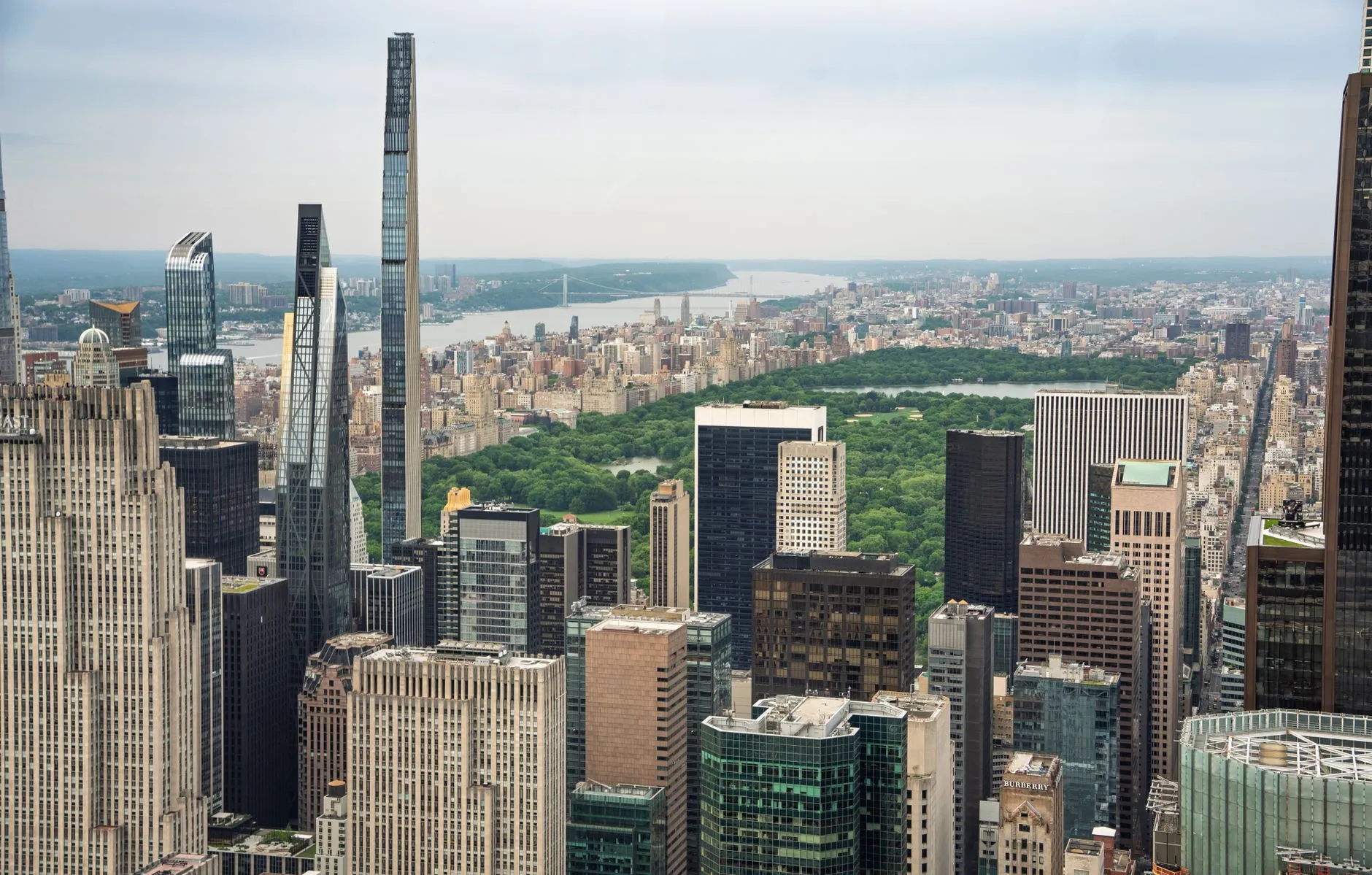 Midtown Manhattan's towers stepping back toward Central Park, with the slender Billionaires' Row skyscrapers at left