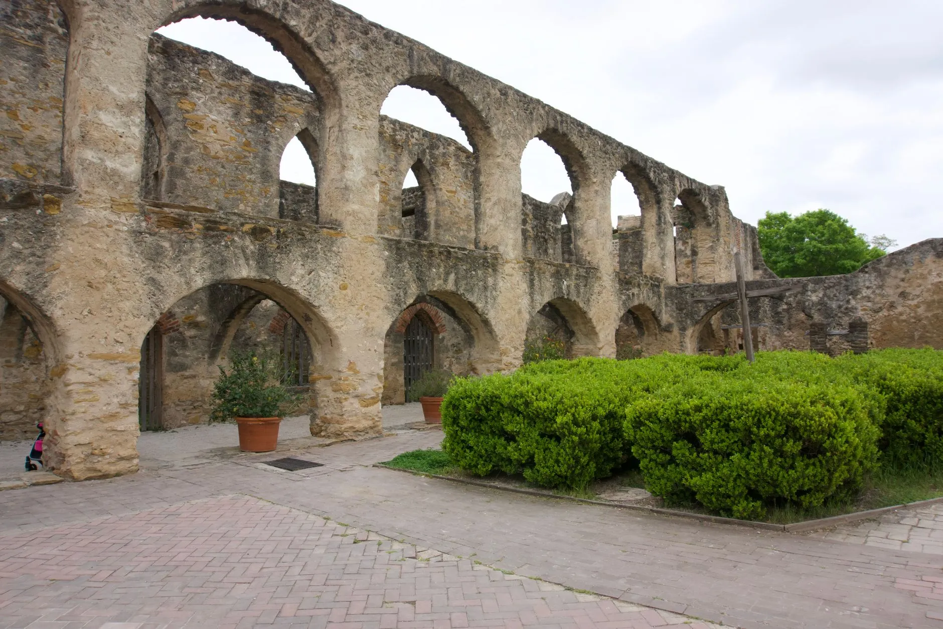 Weathered limestone arches of the convento at Mission San Jose, one of the Spanish colonial missions in San Antonio.